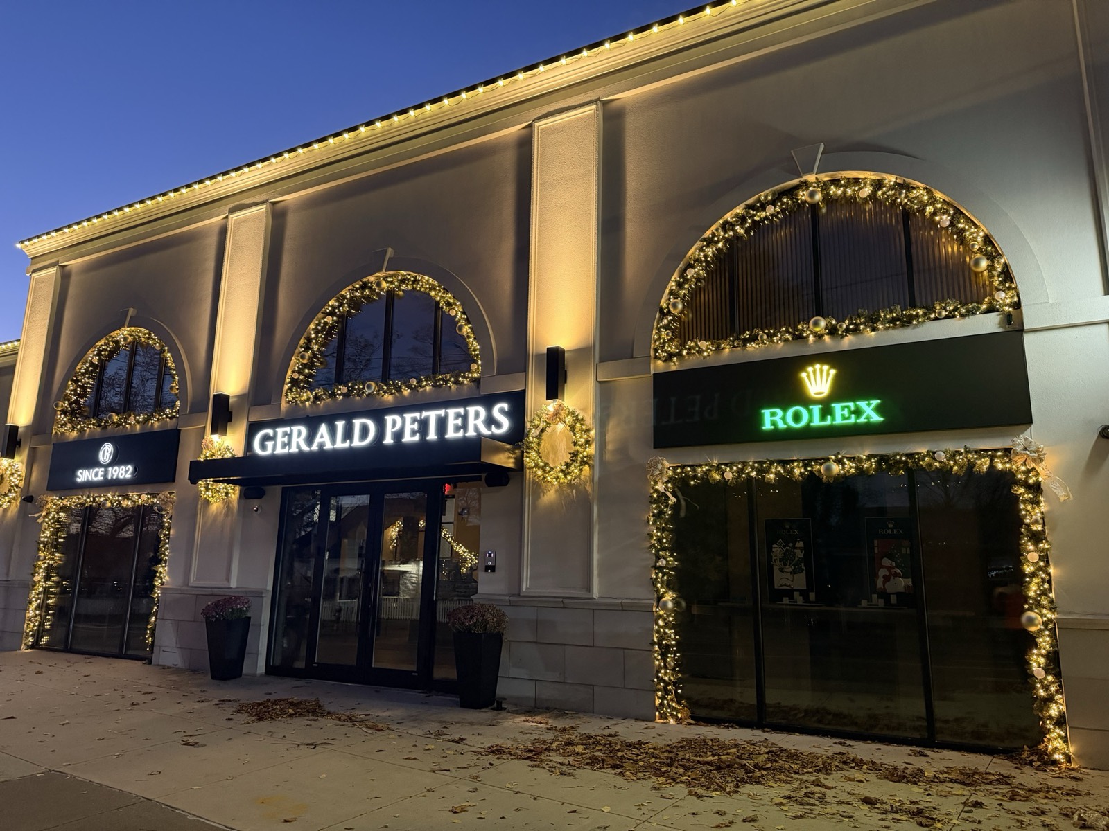 Jewelry storefront with garland-wrapped arches