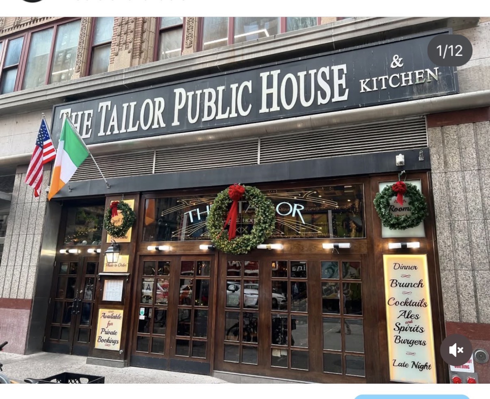 The Tailor Public House storefront with wreaths and garland